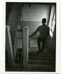 Man Walking Down Stairs