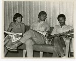 Three Students Reading on a Couch